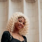 Headshot of a smiling, confident woman in her 40s.